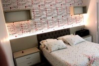 Dormitório Casal com iluminação de LED na cabeceira.